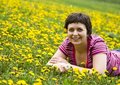 Free Young Woman Lying In A Meadow Stock Image - 9065071