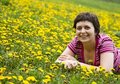 Free Young Woman Lying In A Meadow Stock Photography - 9065072