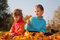 Free Children Sit On Fallen Maple Leaves Stock Photo - 9291110