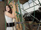 Free Woman Posing By Scaffolding Stock Image - 9366451