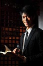Free Asian Man With Book Royalty Free Stock Image - 9409096