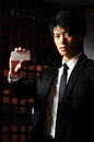 Free Asian Man Holding Blank Card Royalty Free Stock Image - 9409106