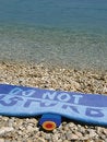 Free Sea And Sun Creme And Towel Do Not Disturb Stock Photography - 9569662