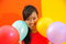 Free Young Asian Woman Holding Balloons Stock Photos - 9801103