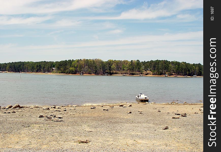 Large lake Allatoona GA also a water reservoir . Boat ashore.