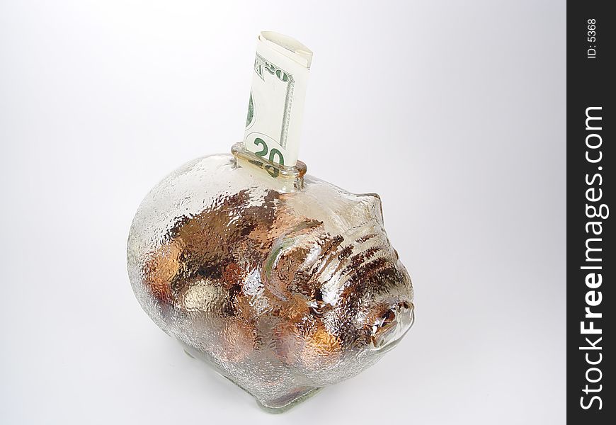 Photo of Glass Piggy Bank With Money