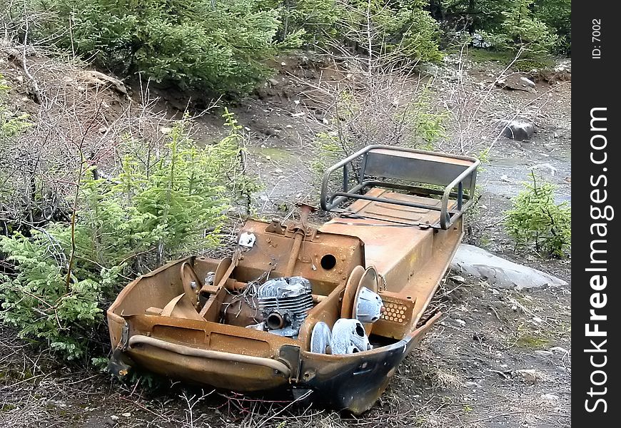 Old Scrap Ski-Doo in the woods all rusty