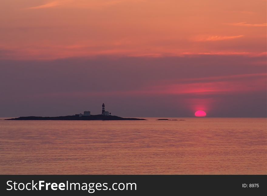 Lighthouse and red sunset, Rogaland, Norway