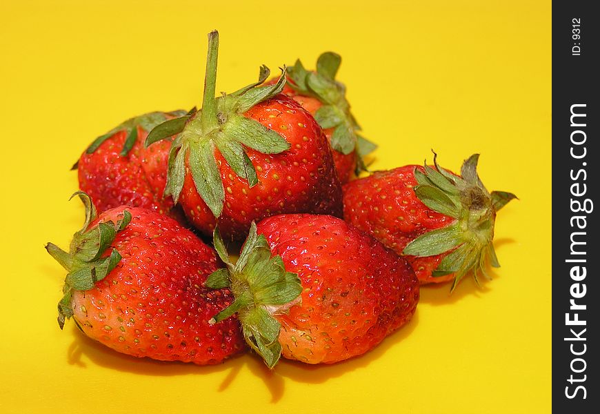 Strawberries on a yellow background