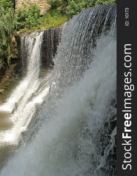 Close up view shot verticle of the falls on the Chagrin River. fast shutter to freeze water motion. Close up view shot verticle of the falls on the Chagrin River. fast shutter to freeze water motion.