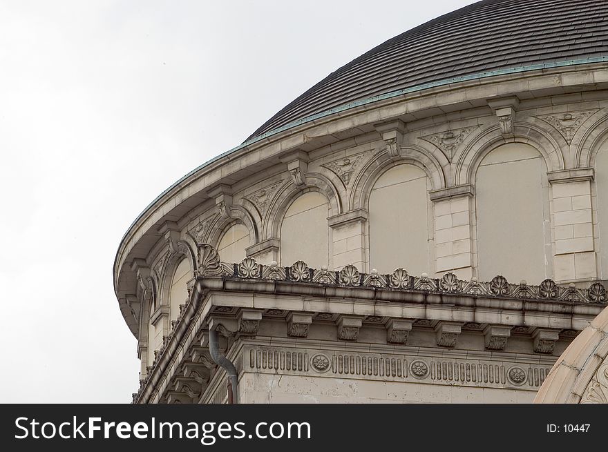 Building detail showing a mix of architectural details near the dome of an old church