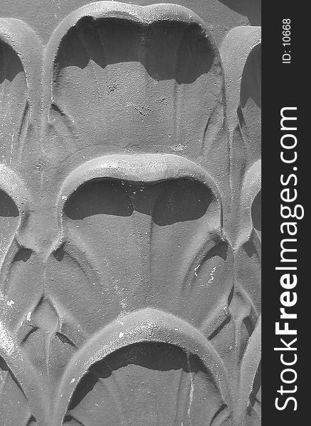 Close-up of ornamentation at the base of a street lamp in Seattle, Washington. Close-up of ornamentation at the base of a street lamp in Seattle, Washington.