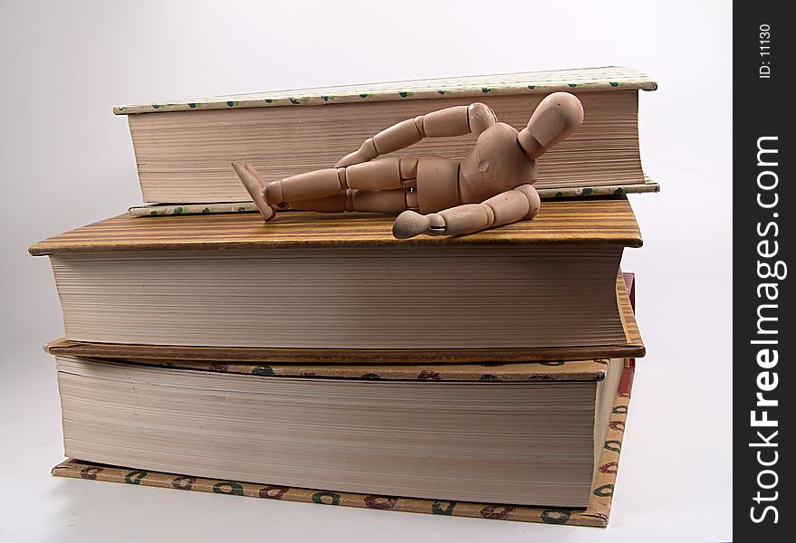 Mannequin Laying On Books