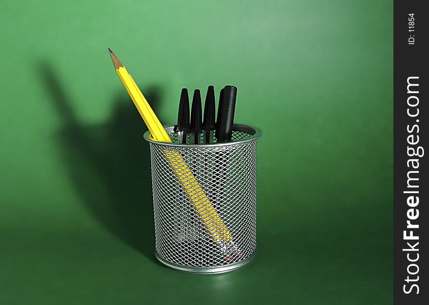 Photo of Pen and Pencil Holder With Green Background