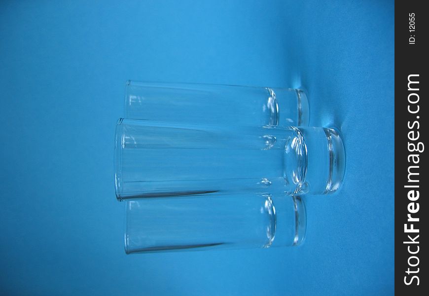 A closeup of three jiggers on blue background. A closeup of three jiggers on blue background.