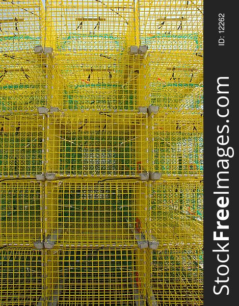 A stack of bright yellow lobster traps