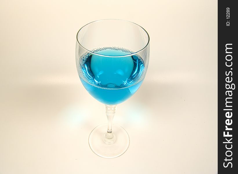 Photo of Wine Glass With Blue Liquid. Photo of Wine Glass With Blue Liquid