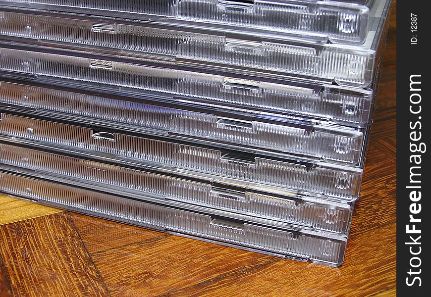 A stack of CDs on parquet floor