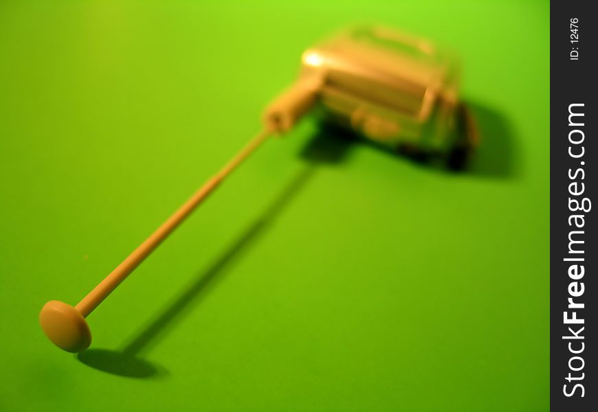 Cell phone on green background, focus on the antenna. Cell phone on green background, focus on the antenna.