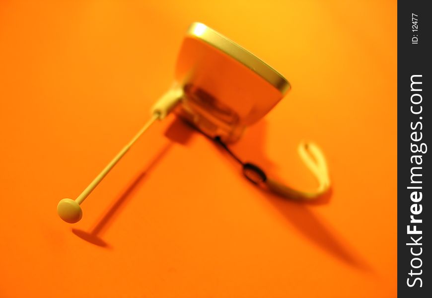 Cell phone on orange background, focus on the antenna. Cell phone on orange background, focus on the antenna.