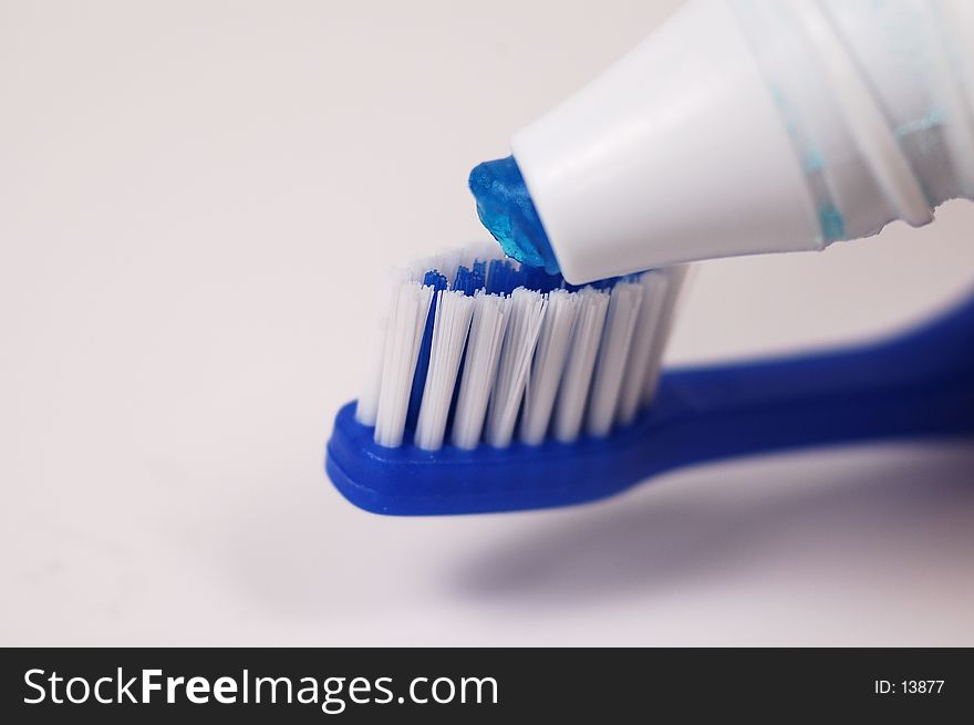 Photo of Paste Being Put on Toothbrush. Photo of Paste Being Put on Toothbrush