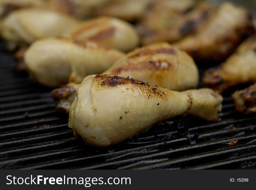 Chicken drumsticks on the barbeque, being grilled up. Chicken drumsticks on the barbeque, being grilled up