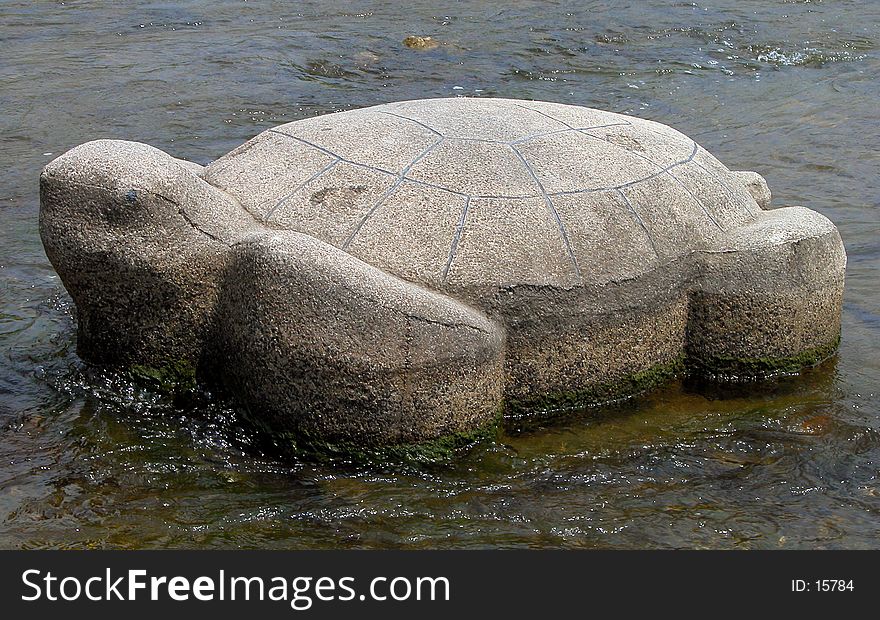 A stone tortoise in the main river in Kyoto-Kamogawa