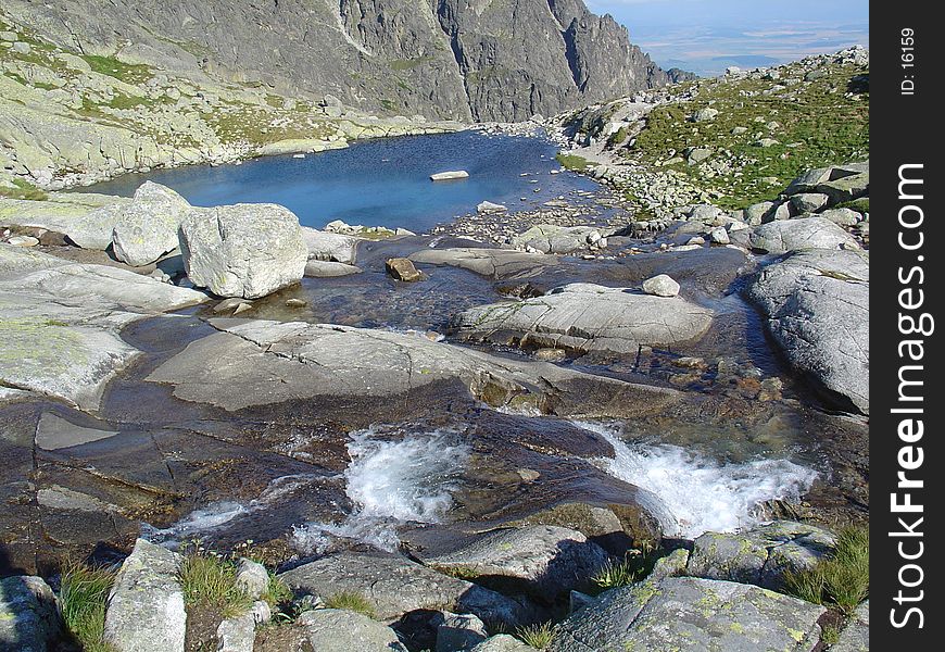 Lake with small waterfall.