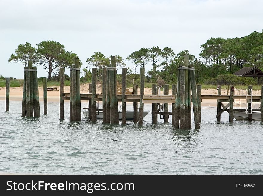 A close up view of a commercial tour boat dock on Cape Lookout, North Carolina. Photo taken at low tide. A close up view of a commercial tour boat dock on Cape Lookout, North Carolina. Photo taken at low tide