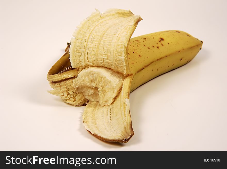 Photo of Peeled Banana With Piece Missing. Photo of Peeled Banana With Piece Missing