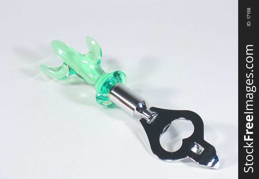 Bottle opener with a green plastic cactus haft. Bottle opener with a green plastic cactus haft.