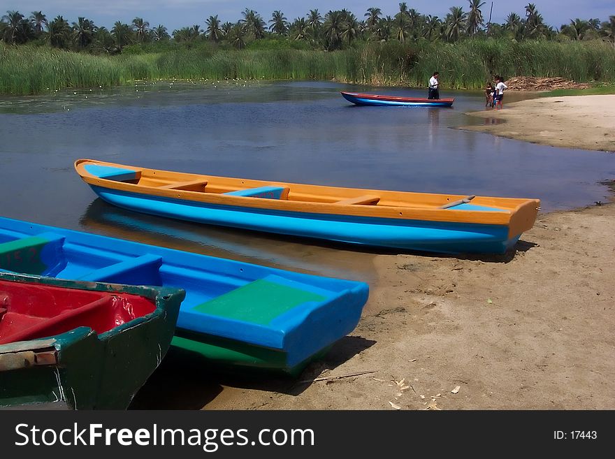 Photo of rowboats at a crocodile lagoon in Huatulco Mexico. Tour costs about $10 US per person. The lagoon holds 40 crocodiles up to 10 feet long. Photo of rowboats at a crocodile lagoon in Huatulco Mexico. Tour costs about $10 US per person. The lagoon holds 40 crocodiles up to 10 feet long.