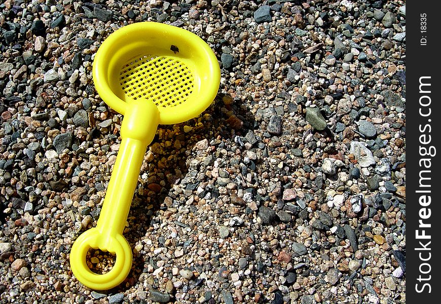 Yellow Sand Shovel on the beach
