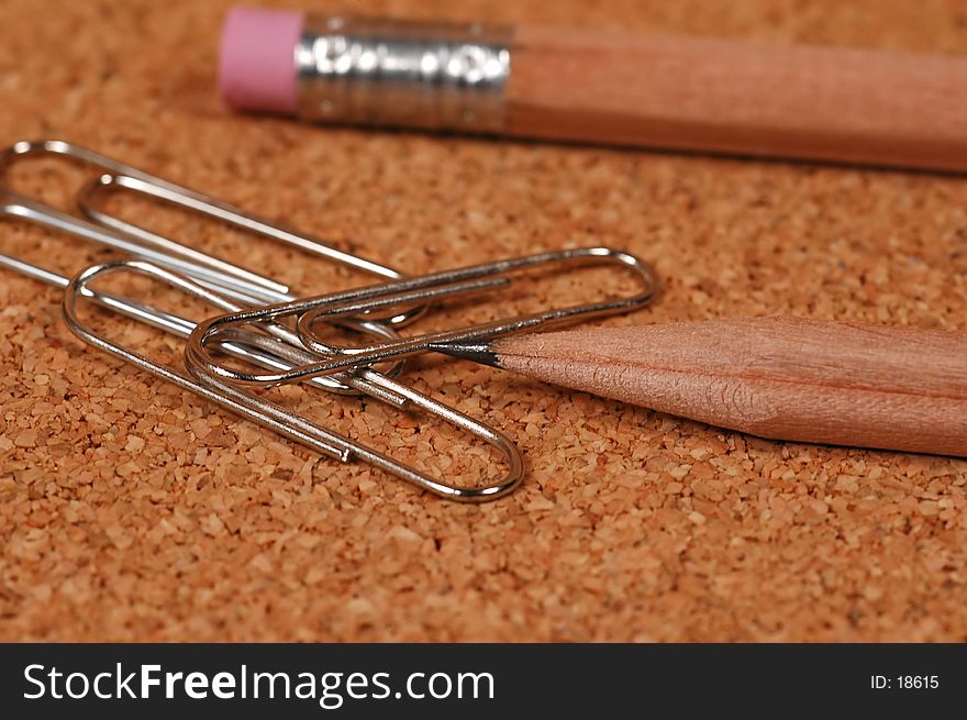 Photo of Pencil and Paperclips.