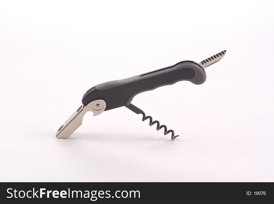 A wine tool featuring a cork screw, lever and knife photographed on a white background