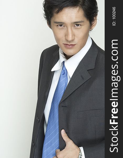An asian businessman in grey suit