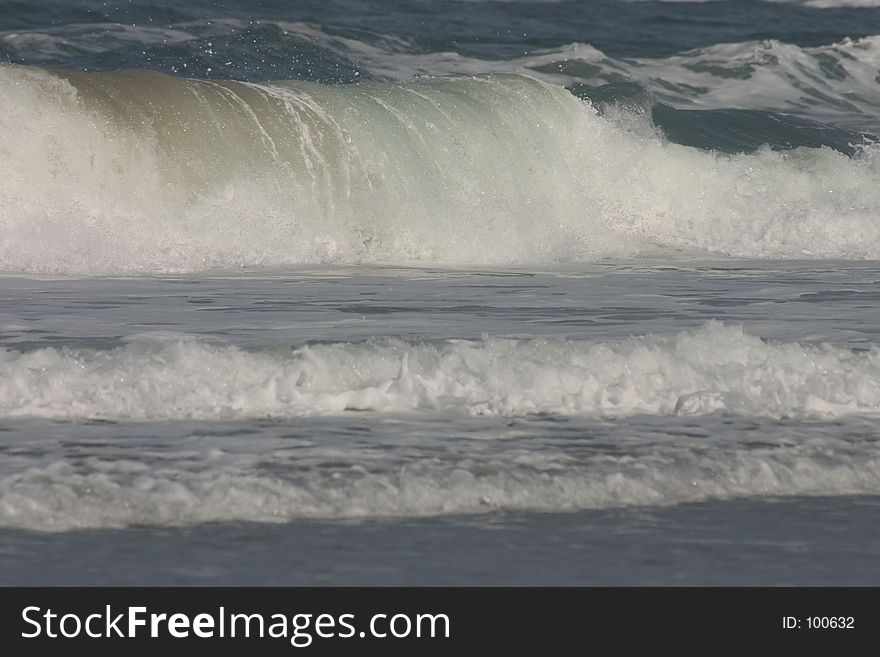 Large waves crashing on shore. Large waves crashing on shore.