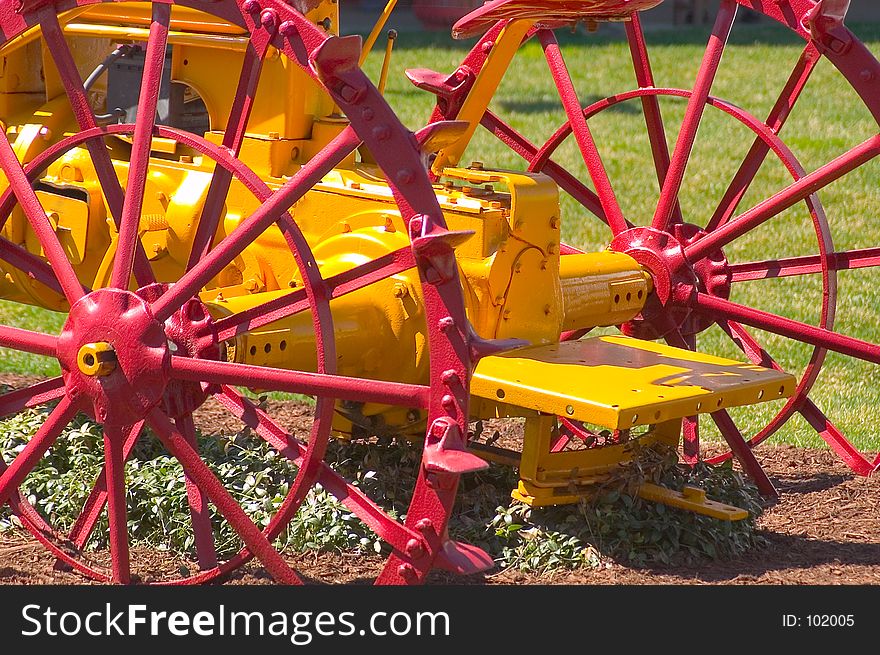 Antique Tractor with all metal wheels. Partial View