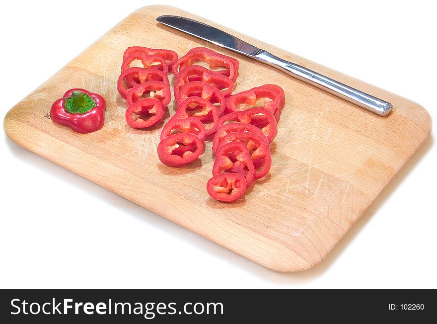 Sliced red pepper on a wooden board