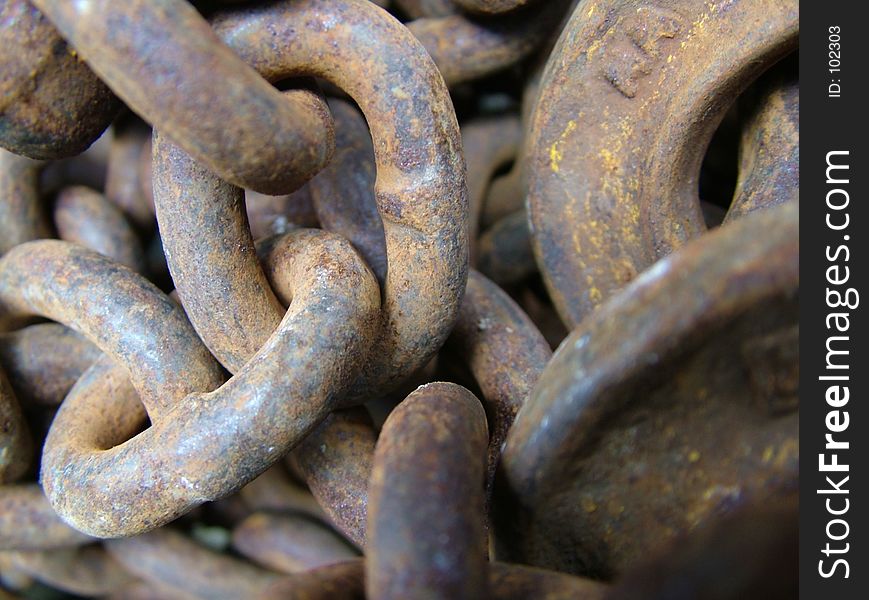 Photo of some old, weathered, rusty old industrial chain. Photo of some old, weathered, rusty old industrial chain.