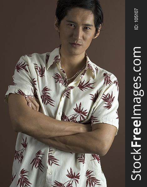 A well-built asian model in a casual shirt. A well-built asian model in a casual shirt