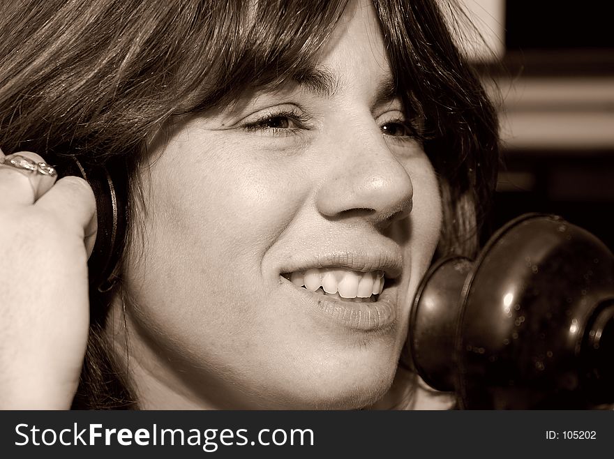 Woman Using a Vintage Telephone. Woman Using a Vintage Telephone