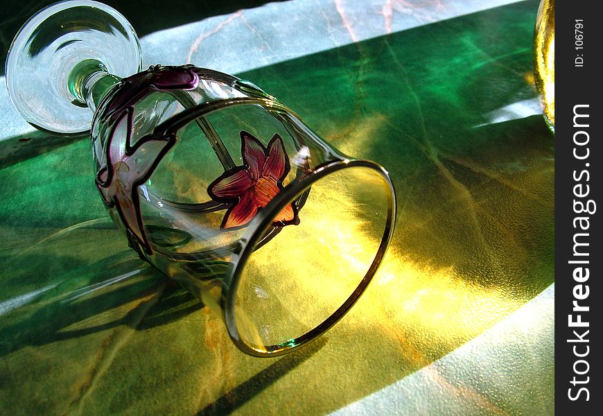 Still life of a wine glass playing with light and shadows. Still life of a wine glass playing with light and shadows.