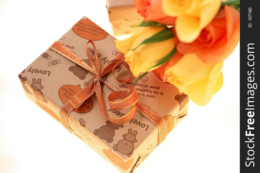 Gift box and orange roses.