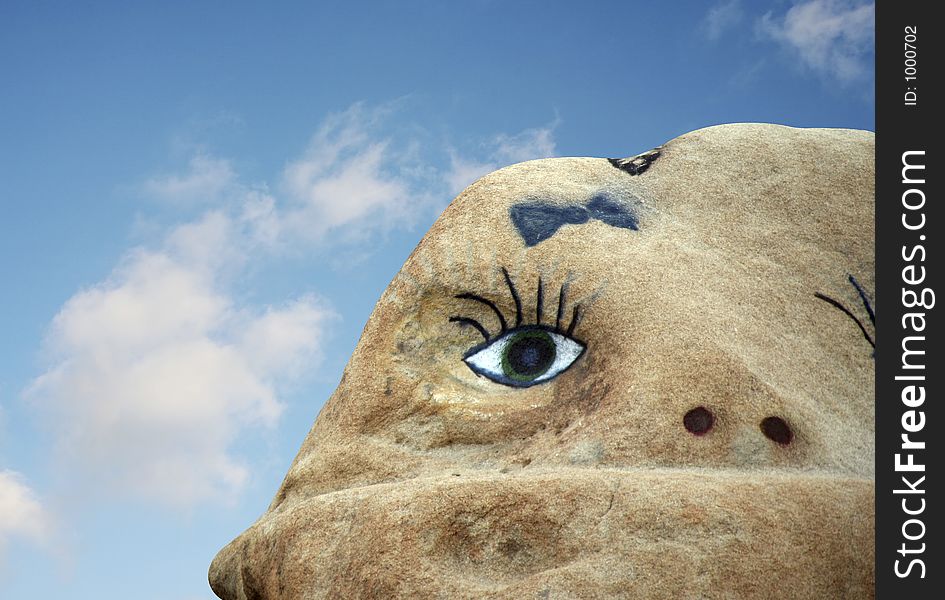 A face painted on a rock. A face painted on a rock