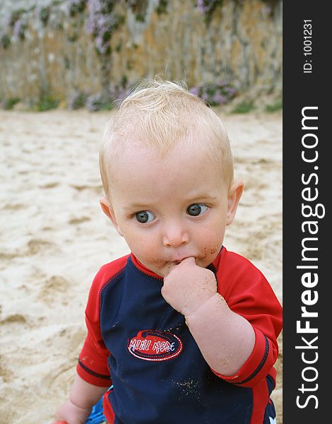 Small child exploring a beach in Cornwall. Small child exploring a beach in Cornwall.