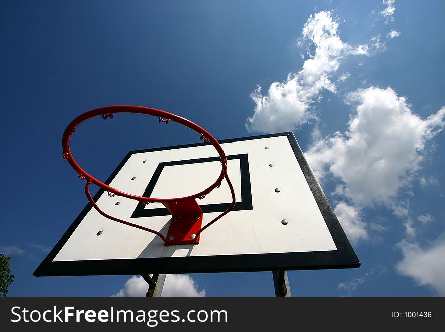 Basket ball net against a blue sky