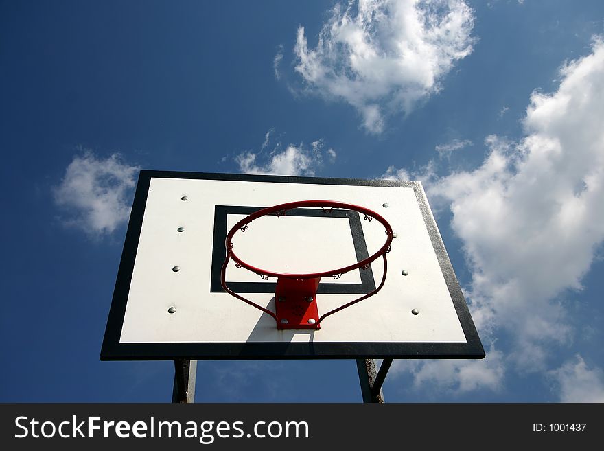 Basket ball net against a blue sky