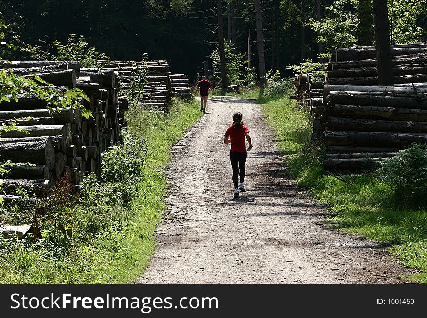 Running on a path in the forest of rudeskov in denmark