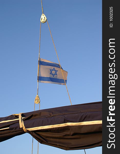 The flag of Israel on a boat in sea. The flag of Israel on a boat in sea